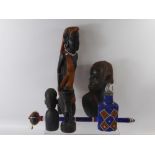 A Collection of Tribal Ware, including a beaded 'knob kerrie', a glass bottle, two tribal masks