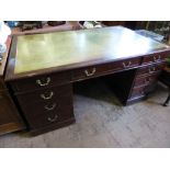 An Edwardian Mahogany Partner's Desk, four short drawers on the left, one central long drawer, two