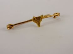 An Antique 15 ct Gold Fox Head Stock Pin, approx wt 2.9 gms.