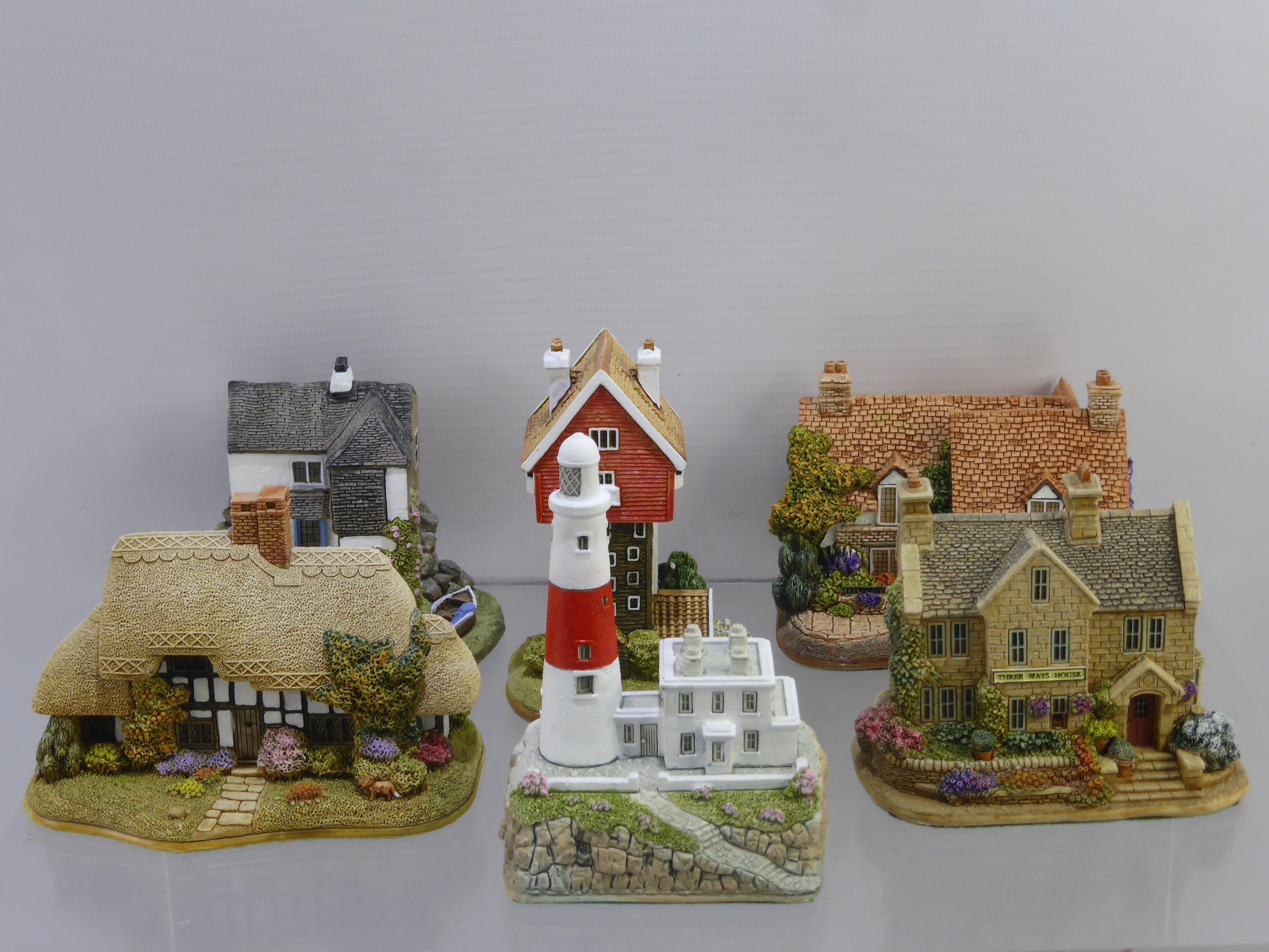 A Collection of Lilliput Lane Models, including "No Place like Moms", "Very Happy Returns", "Barn