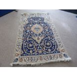 A Hand Knotted Persian Wool and Silk Nain Rug, approx 210 x 120 cms.