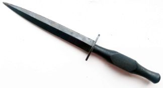 A Rare WWII Wooden Handled Fairbairn Sykes Fighting Knife, the guard stamped with military 'broad