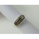 A Lady's 18 ct White Gold Half Hoop Diamond Ring. Seventeen baguettes and 11 round cut dias,