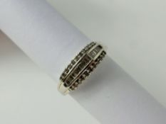 A Lady's 18 ct White Gold Half Hoop Diamond Ring. Seventeen baguettes and 11 round cut dias,