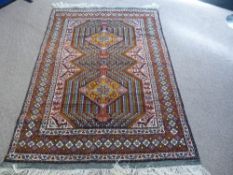 A Hand Knotted Persian Kurdish Rug, approx 200 x 128 cms.