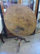 An Antique Oak Tilt Top Table, on tripod base. (af)