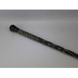 An Antique Ceylonese Ebony and Ivory Inlaid Walking Stick, a large leather crop together with a