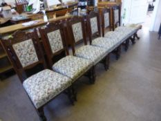 A Set of Six Mahogany Edwardian Dining Chairs, upholstered in tapestry.