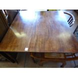 A Victorian Mahogany Drop Leaf Supper Table, the table having turned legs on casters, approx 103 x