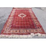 A Hand Knotted Persian Rug, approx 280 x 170 cms.