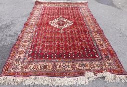 A Hand Knotted Persian Rug, approx 280 x 170 cms.