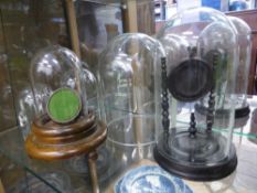Two Antique Pocket Watch Stands, one ebonised the second mahogany, both with glass domes together