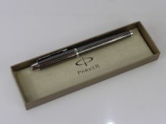 A Black Metal Parker Roller Ball Pen, in original box.