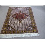 A Hand Knotted Persian Kurdish Rug, approx 163 x 134 cms.
