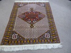 A Hand Knotted Persian Kurdish Rug, approx 163 x 134 cms.