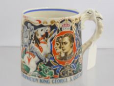 A Dame Laura Knight Coronation King George and Queen Elizabeth Lion Handle Commemorative Mug.