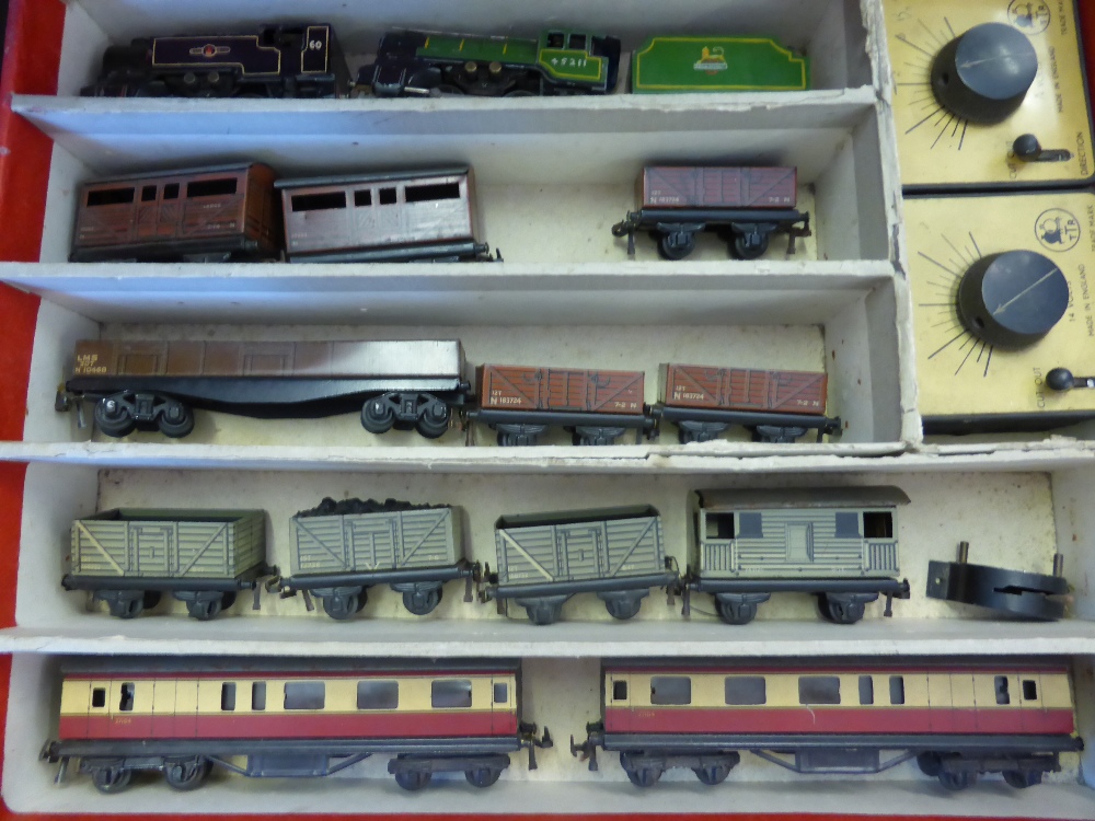 A Vintage TRIX Twin Railway Set, including two engines, miscellaneous carriages, trucks, transformer