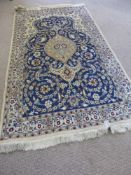 A Hand Knotted Persian Wool and Silk Nain Rug, approx 206 x 116 cms.