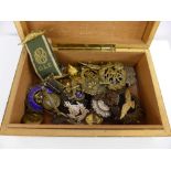 A Wooden Box Containing Various Military Insignia, sweetheart badges, medals, collar badges etc.