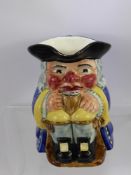 A Clarice Cliff Newport Pottery Co., Toby Jug, approx 16 cms.