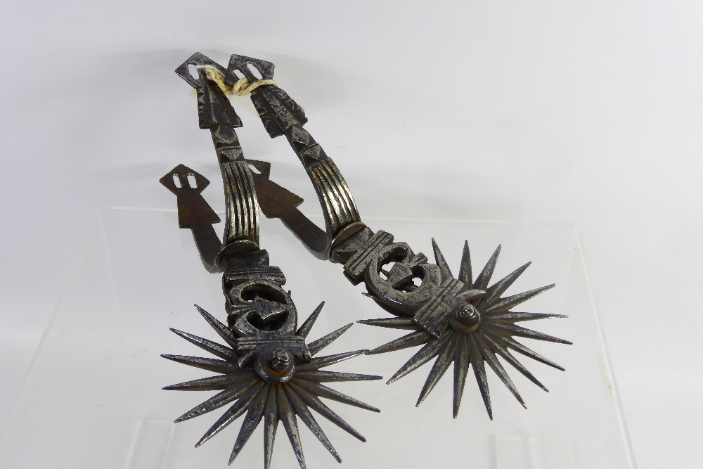 A Pair of 19th Century Steel Spanish Colonial Spurs, with 19 rowels, approx 24 cms.