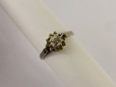 A Lady's Vintage Platinum and Diamond Cluster Ring, the ring set with a central old cut diamond 30/