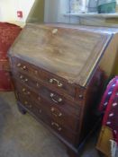 An Antique Writing Bureau, five graduated drawers, drop front with fitted burgundy leather interior,