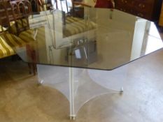 A Contemporary Perspex and Chrome Table, with octagonal smoky glass top, approx 152 cms dia.