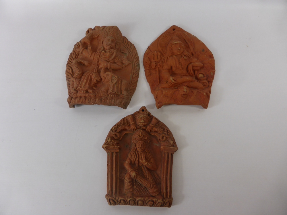 Three Terracotta Wall Plaques, depicting Indian deity, together with a terracotta seated buddha. ( - Image 2 of 2