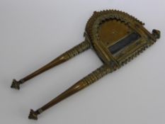 An Antique Indian Brass "Betel Nut" Cutter, with horse shoe shaped loop and broad blade with