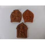 Three Terracotta Wall Plaques, depicting Indian deity, together with a terracotta seated buddha. (