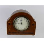 A French Oak and Rosewood Art Deco Mantel Clock, movement stamped S.F.R.A., the clock with