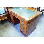 An Edwardian Twin Pedestal Leather Top Desk, with Art Nouveau handles, approx 66 x 104 x 70 cms,
