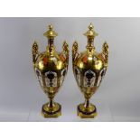 A Pair of Imari Pattern Royal Crown Derby Twin Handled Vases. The vases of ovoid urn form, with