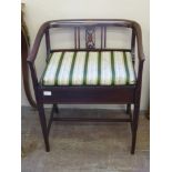 An Edwardian Inlaid Music Chair, upholstered in Regency stripe, approx 57 x 43 x 58 cms.