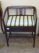 An Edwardian Inlaid Music Chair, upholstered in Regency stripe, approx 57 x 43 x 58 cms.