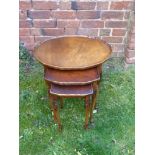 A Nest of Three Oval Oak Tables, on tapered legs. (3)