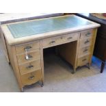 A Pine Edwardian Office Desk, four short drawers to either side and one central drawer, green tooled