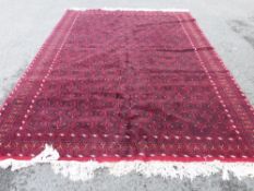 A Hand Knotted Afghan Baluch Carpet, approx 310 x 216 cms.