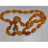 An Antique Chinese Butterscotch Amber Necklace, approx 88 cms long, beads approx 2.5 cms each, on