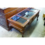A Rosewood Glass Topped Coffee Table, with two drawers, raised on pad feet, approx 123 x 56 x 50.