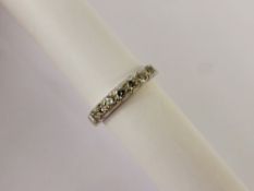A Lady's 9 ct White Gold Half Eternity Ring, the ring set with seven diamonds approx 35 pts total,