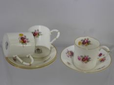Royal Worcester Bone China Coffee Cans and Saucers, decorated with floral spray.