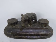 A Black Forest Table Ink Well and Pen Rest, depicting a bear, approx 31 x 16 x 11 cms.