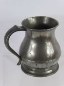 Two English Pewter 1 Quart Measures, of bulbous form , 19th century.