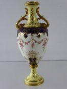 A 19th Century Coalport Ewer, hand painted with floral swags.