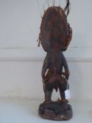 An Antique Gabonese Figure of a Naked Warrior.