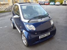 A 2004 Registered 4/2 Smart Car, the City Passion 61 Automatic Convertible having covered only 54