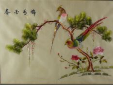 Two Chinese Embroideries on Silk, depicting an oriental pheasant seated on a tree branch, the