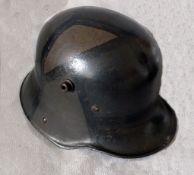 A German WWI M16 Camouflage Remscheid-Hasten Helmet, the helmet having leather sizing band and